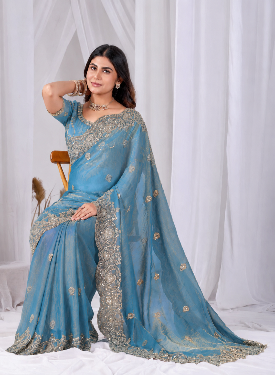 Azure Blue Tikki Moti Work Embroidered Designer Saree Azure Blue Tikki Moti Work Embroidered Designer Saree + The Azure Blue Tikki Moti Work Embroidered Designer Saree brings tikki (metallic sequin) and moti (pearl-bead) hand embroidery to a azure blue base, and it's built for anyone comparing options for an azure blue saree rather than something purely decorative. The colour reads true in both daylight and indoor event lighting, which matters more than it sounds &mdash; a lot of sarees photograph differently under venue lighting than they do in a product shot, and this one has been chosen to hold its tone consistently. &bull; Craftsmanship