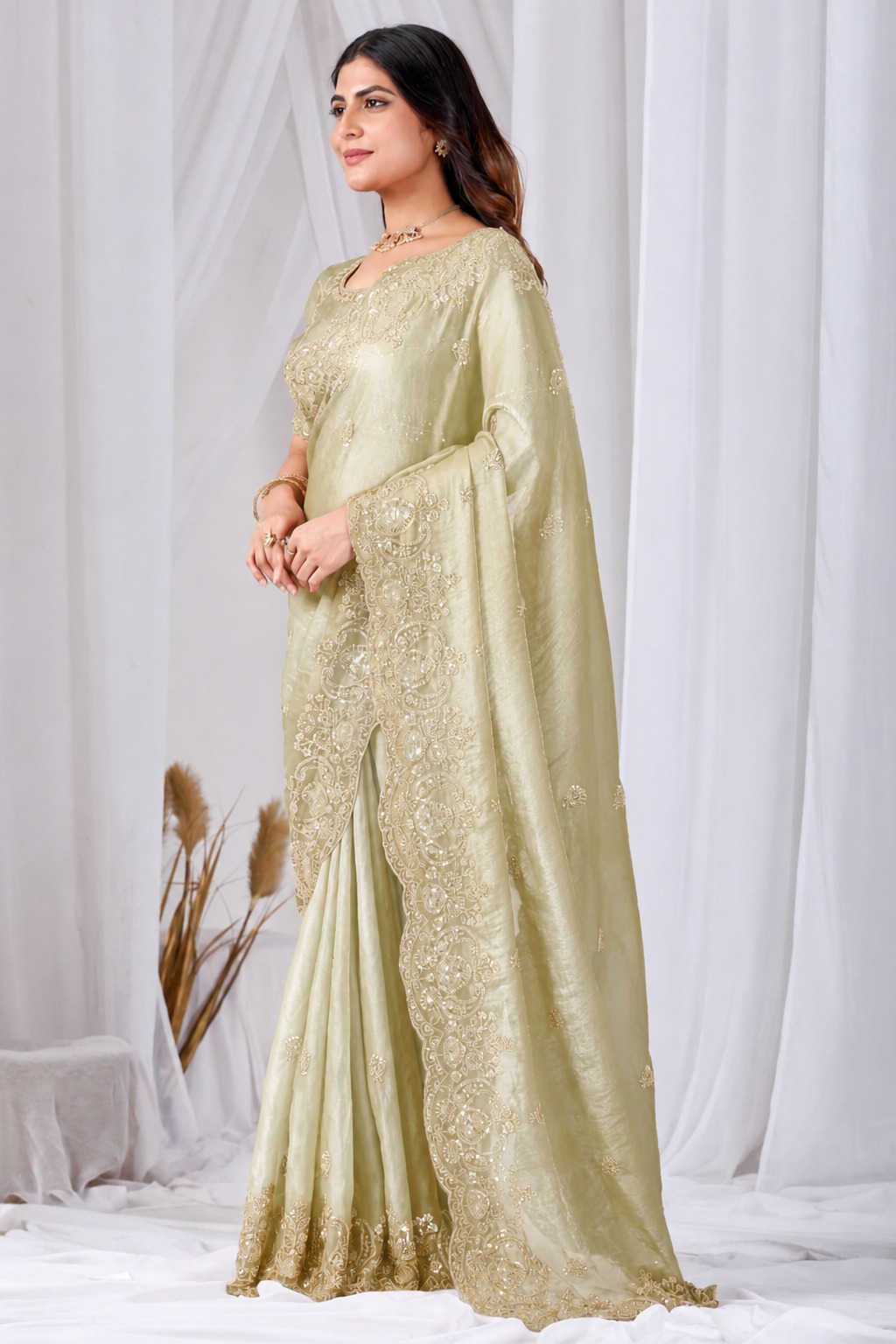 Golden Tikki Moti Work Embroidered Designer Saree Golden Tikki Moti Work Embroidered Designer Saree + The Golden Tikki Moti Work Embroidered Designer Saree brings tikki (metallic sequin) and moti (pearl-bead) hand embroidery to a golden base, and it's built for anyone comparing options for a golden saree rather than something purely decorative. The colour reads true in both daylight and indoor event lighting, which matters more than it sounds &mdash; a lot of sarees photograph differently under venue lighting than they do in a product shot, and this one has been chosen to hold its tone consistently. &bull; Craftsmanship
