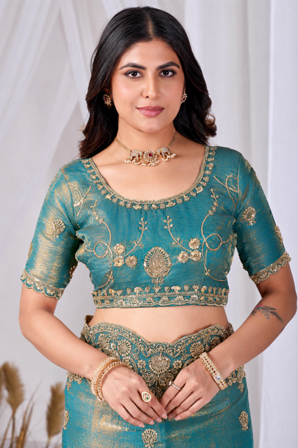 Teal Blue Tikki Moti Work Embroidered Designer Saree Teal Blue Tikki Moti Work Embroidered Designer Saree + The Teal Blue Tikki Moti Work Embroidered Designer Saree brings tikki (metallic sequin) and moti (pearl-bead) hand embroidery to a teal blue base, and it's built for anyone comparing options for a teal color saree rather than something purely decorative. The colour reads true in both daylight and indoor event lighting, which matters more than it sounds &mdash; a lot of sarees photograph differently under venue lighting than they do in a product shot, and this one has been chosen to hold its tone consistently. &bull; Craftsmanship