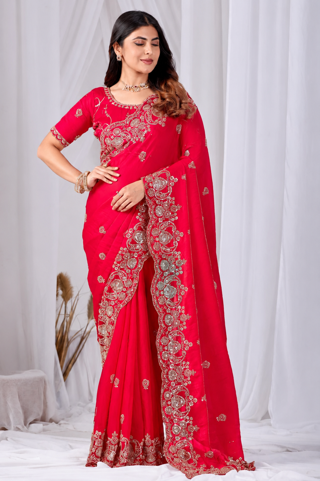 Red Tikki Moti Work Embroidered Designer Saree Red Tikki Moti Work Embroidered Designer Saree + The Red Tikki Moti Work Embroidered Designer Saree brings tikki (metallic sequin) and moti (pearl-bead) hand embroidery to a red base, and it's built for anyone comparing options for a red saree rather than something purely decorative. The colour reads true in both daylight and indoor event lighting, which matters more than it sounds &mdash; a lot of sarees photograph differently under venue lighting than they do in a product shot, and this one has been chosen to hold its tone consistently. &bull; Craftsmanship