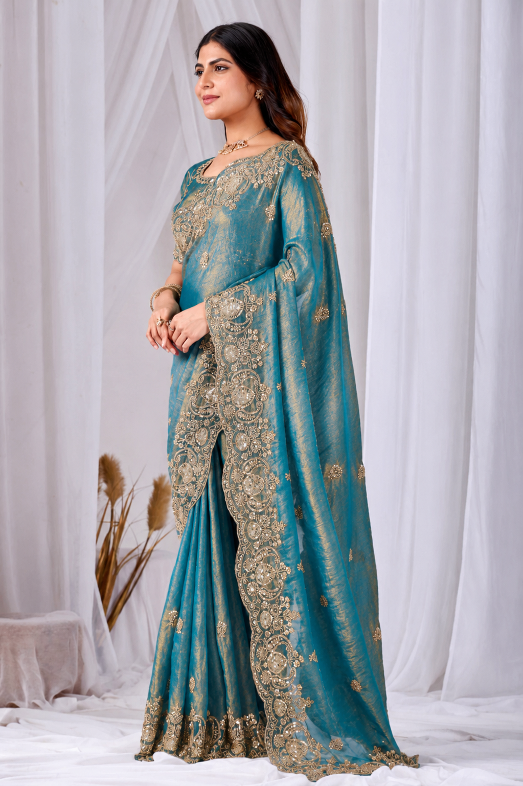 Teal Blue Tikki Moti Work Embroidered Designer Saree Teal Blue Tikki Moti Work Embroidered Designer Saree + The Teal Blue Tikki Moti Work Embroidered Designer Saree brings tikki (metallic sequin) and moti (pearl-bead) hand embroidery to a teal blue base, and it's built for anyone comparing options for a teal color saree rather than something purely decorative. The colour reads true in both daylight and indoor event lighting, which matters more than it sounds &mdash; a lot of sarees photograph differently under venue lighting than they do in a product shot, and this one has been chosen to hold its tone consistently. &bull; Craftsmanship