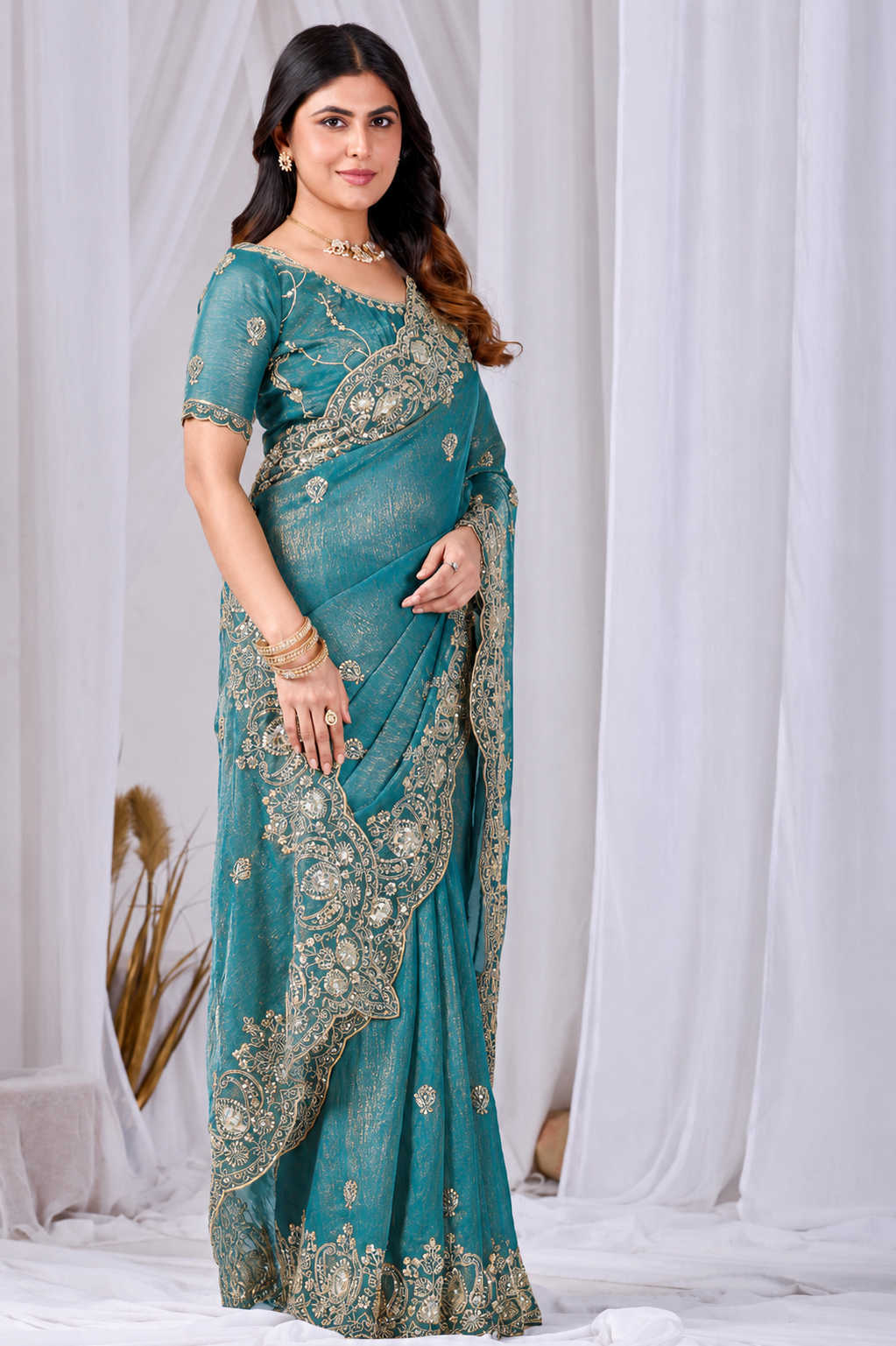 Teal Blue Tikki Moti Work Embroidered Designer Saree Teal Blue Tikki Moti Work Embroidered Designer Saree + The Teal Blue Tikki Moti Work Embroidered Designer Saree brings tikki (metallic sequin) and moti (pearl-bead) hand embroidery to a teal blue base, and it's built for anyone comparing options for a teal color saree rather than something purely decorative. The colour reads true in both daylight and indoor event lighting, which matters more than it sounds &mdash; a lot of sarees photograph differently under venue lighting than they do in a product shot, and this one has been chosen to hold its tone consistently. &bull; Craftsmanship