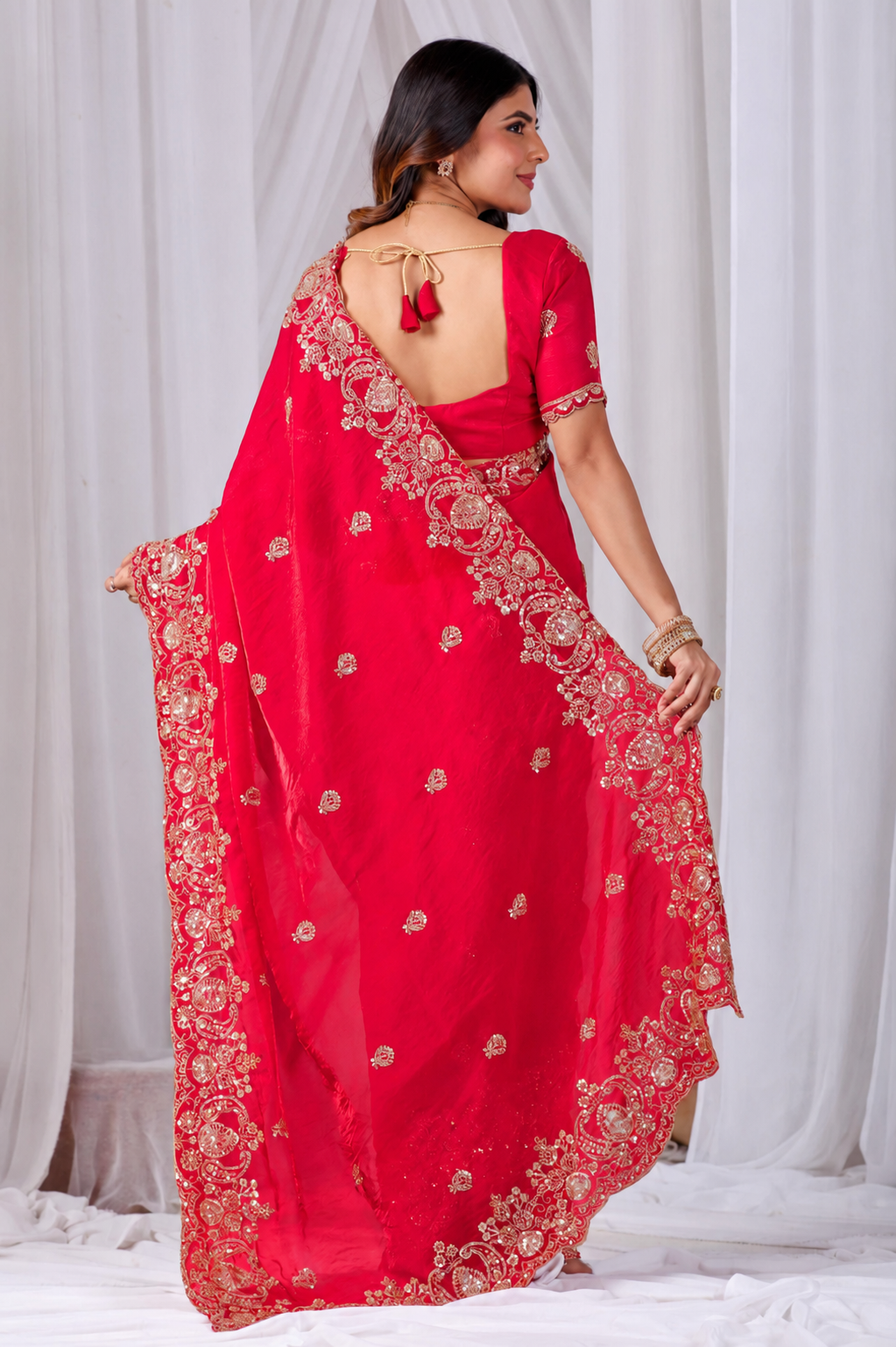 Red Tikki Moti Work Embroidered Designer Saree Red Tikki Moti Work Embroidered Designer Saree + The Red Tikki Moti Work Embroidered Designer Saree brings tikki (metallic sequin) and moti (pearl-bead) hand embroidery to a red base, and it's built for anyone comparing options for a red saree rather than something purely decorative. The colour reads true in both daylight and indoor event lighting, which matters more than it sounds &mdash; a lot of sarees photograph differently under venue lighting than they do in a product shot, and this one has been chosen to hold its tone consistently. &bull; Craftsmanship