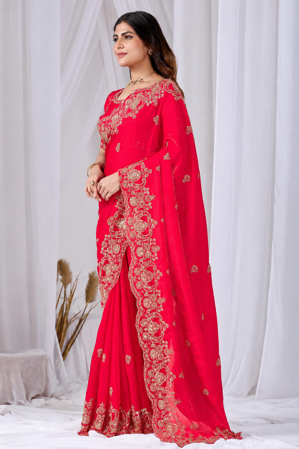 Red Tikki Moti Work Embroidered Designer Saree Red Tikki Moti Work Embroidered Designer Saree + The Red Tikki Moti Work Embroidered Designer Saree brings tikki (metallic sequin) and moti (pearl-bead) hand embroidery to a red base, and it's built for anyone comparing options for a red saree rather than something purely decorative. The colour reads true in both daylight and indoor event lighting, which matters more than it sounds &mdash; a lot of sarees photograph differently under venue lighting than they do in a product shot, and this one has been chosen to hold its tone consistently. &bull; Craftsmanship
