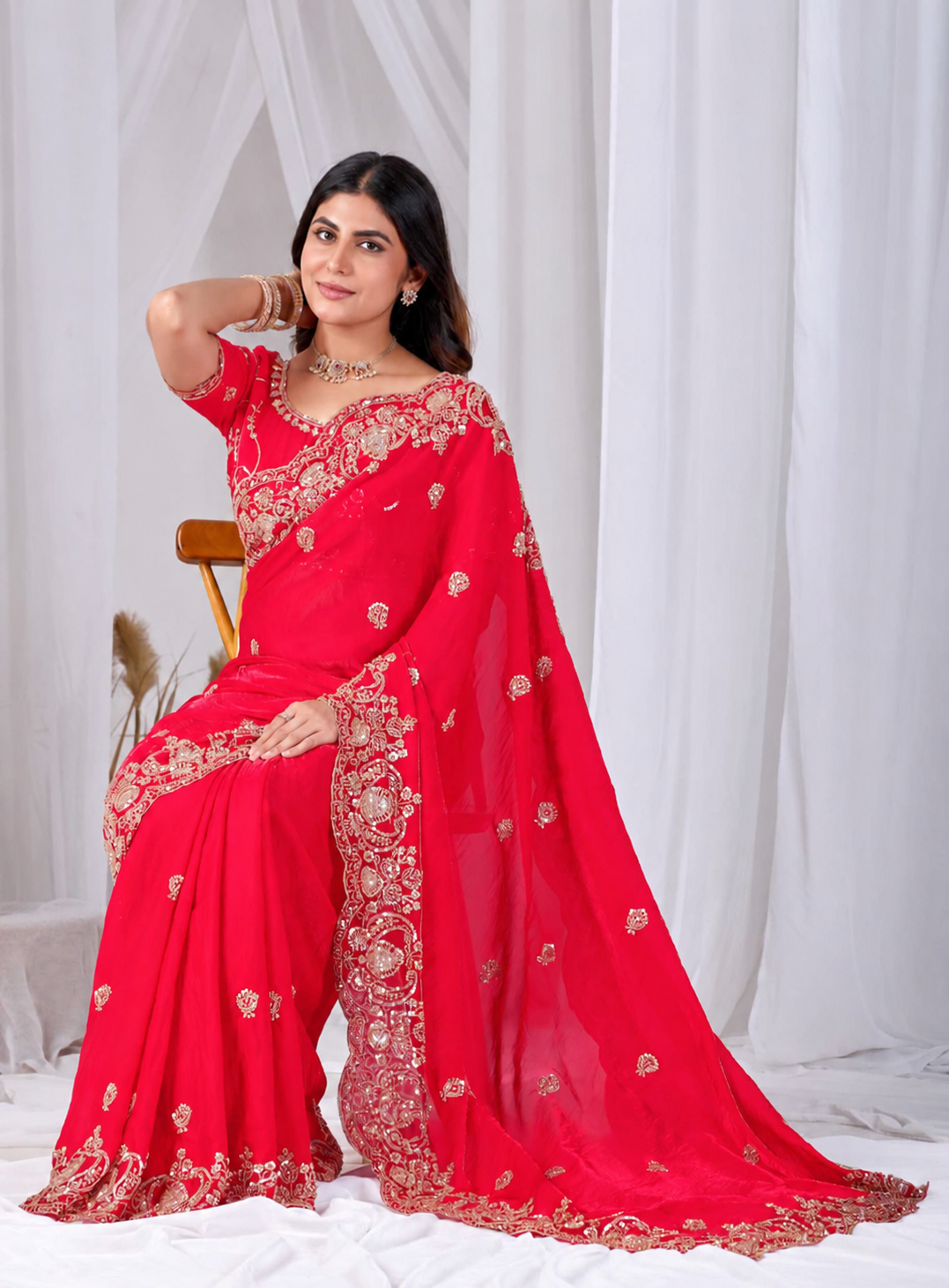 Red Tikki Moti Work Embroidered Designer Saree Red Tikki Moti Work Embroidered Designer Saree + The Red Tikki Moti Work Embroidered Designer Saree brings tikki (metallic sequin) and moti (pearl-bead) hand embroidery to a red base, and it's built for anyone comparing options for a red saree rather than something purely decorative. The colour reads true in both daylight and indoor event lighting, which matters more than it sounds &mdash; a lot of sarees photograph differently under venue lighting than they do in a product shot, and this one has been chosen to hold its tone consistently. &bull; Craftsmanship