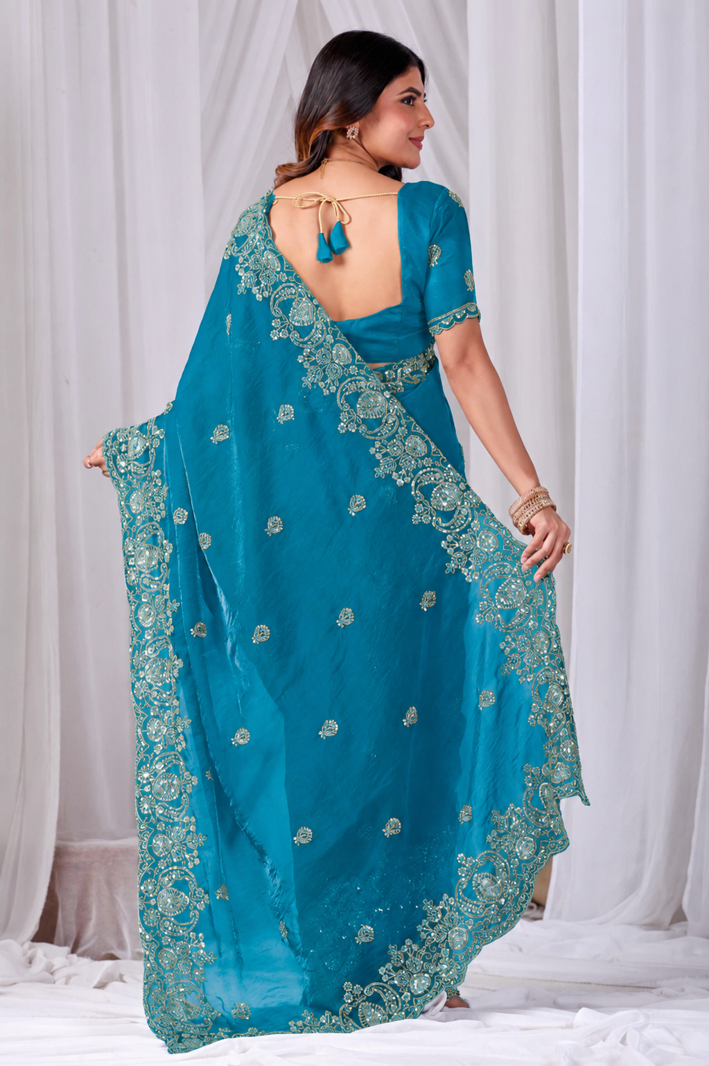 Sky Blue Tikki Moti Work Embroidered Designer Saree Sky Blue Tikki Moti Work Embroidered Designer Saree + The Sky Blue Tikki Moti Work Embroidered Designer Saree brings tikki (metallic sequin) and moti (pearl-bead) hand embroidery to a sky blue base, and it's built for anyone comparing options for a sky sarees rather than something purely decorative. The colour reads true in both daylight and indoor event lighting, which matters more than it sounds &mdash; a lot of sarees photograph differently under venue lighting than they do in a product shot, and this one has been chosen to hold its tone consistently. &bull; Craftsmanship