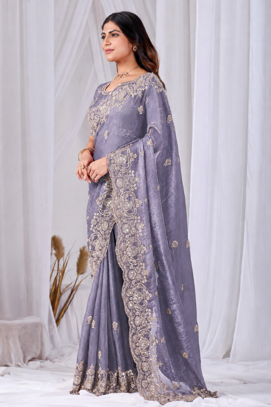 Purple Tikki Moti Work Embroidered Designer Saree Purple Tikki Moti Work Embroidered Designer Saree + The Purple Tikki Moti Work Embroidered Designer Saree brings tikki (metallic sequin) and moti (pearl-bead) hand embroidery to a purple base, and it's built for anyone comparing options for a purple saree rather than something purely decorative. The colour reads true in both daylight and indoor event lighting, which matters more than it sounds &mdash; a lot of sarees photograph differently under venue lighting than they do in a product shot, and this one has been chosen to hold its tone consistently. &bull; Craftsmanship