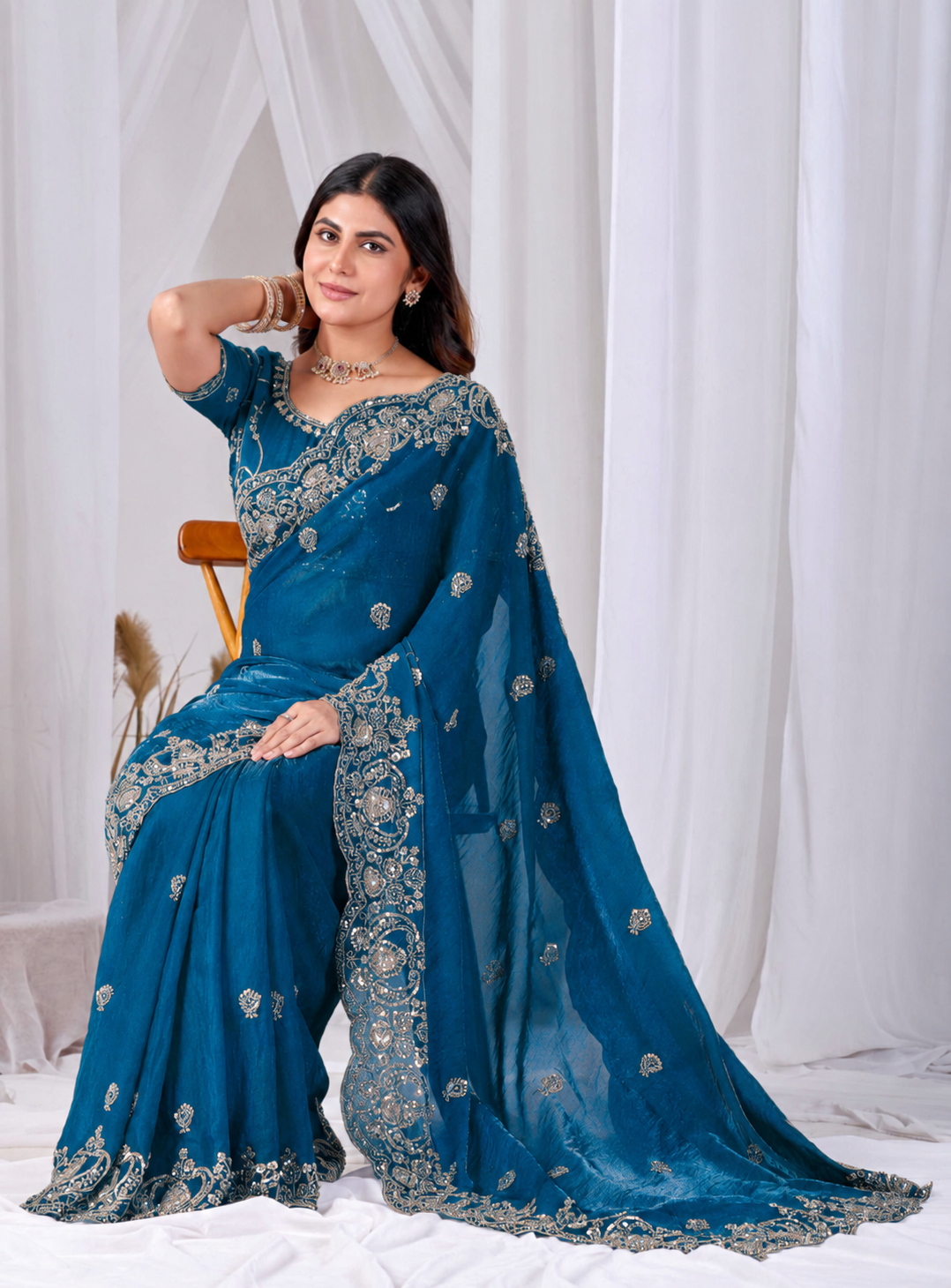Blue Tikki Moti Work Embroidered Designer Saree Blue Tikki Moti Work Embroidered Designer Saree + The Blue Tikki Moti Work Embroidered Designer Saree brings tikki (metallic sequin) and moti (pearl-bead) hand embroidery to a blue base, and it's built for anyone comparing options for a blue saree rather than something purely decorative. The colour reads true in both daylight and indoor event lighting, which matters more than it sounds &mdash; a lot of sarees photograph differently under venue lighting than they do in a product shot, and this one has been chosen to hold its tone consistently. &bull; Craftsmanship