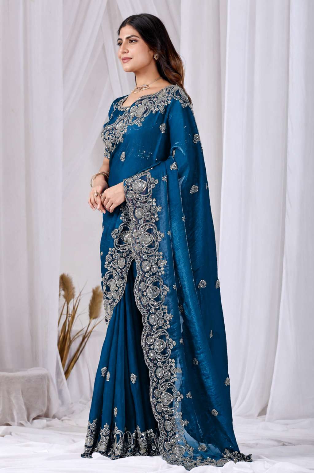 Blue Tikki Moti Work Embroidered Designer Saree Blue Tikki Moti Work Embroidered Designer Saree + The Blue Tikki Moti Work Embroidered Designer Saree brings tikki (metallic sequin) and moti (pearl-bead) hand embroidery to a blue base, and it's built for anyone comparing options for a blue saree rather than something purely decorative. The colour reads true in both daylight and indoor event lighting, which matters more than it sounds &mdash; a lot of sarees photograph differently under venue lighting than they do in a product shot, and this one has been chosen to hold its tone consistently. &bull; Craftsmanship
