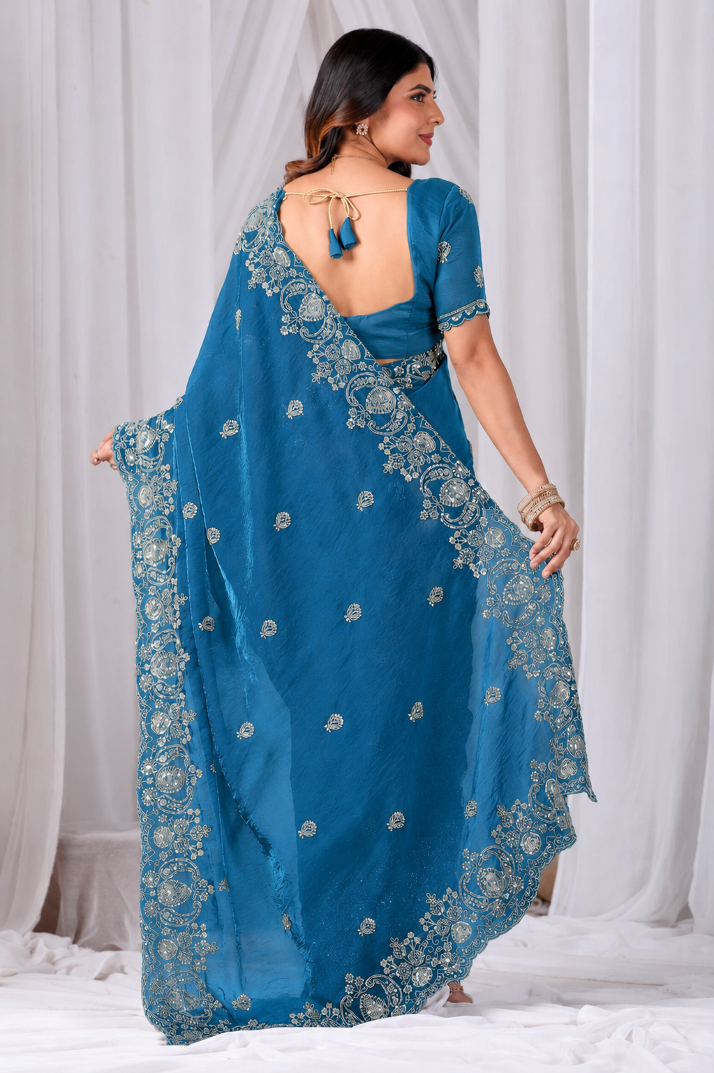 Blue Tikki Moti Work Embroidered Designer Saree Blue Tikki Moti Work Embroidered Designer Saree + The Blue Tikki Moti Work Embroidered Designer Saree brings tikki (metallic sequin) and moti (pearl-bead) hand embroidery to a blue base, and it's built for anyone comparing options for a blue saree rather than something purely decorative. The colour reads true in both daylight and indoor event lighting, which matters more than it sounds &mdash; a lot of sarees photograph differently under venue lighting than they do in a product shot, and this one has been chosen to hold its tone consistently. &bull; Craftsmanship