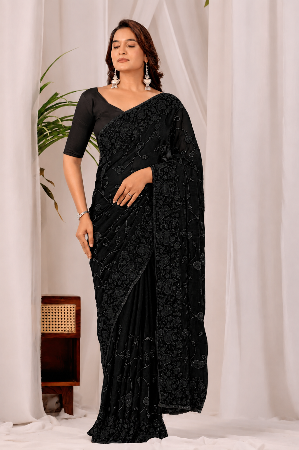 Black Regal Floral Heritage Saree Black Regal Floral Heritage Saree + The Black Regal Floral Heritage Saree brings traditional floral motif weaving to a black base, and it's built for anyone comparing options for a black saree rather than something purely decorative. The colour reads true in both daylight and indoor event lighting, which matters more than it sounds &mdash; a lot of sarees photograph differently under venue lighting than they do in a product shot, and this one has been chosen to hold its tone consistently. &bull; Craftsmanship
