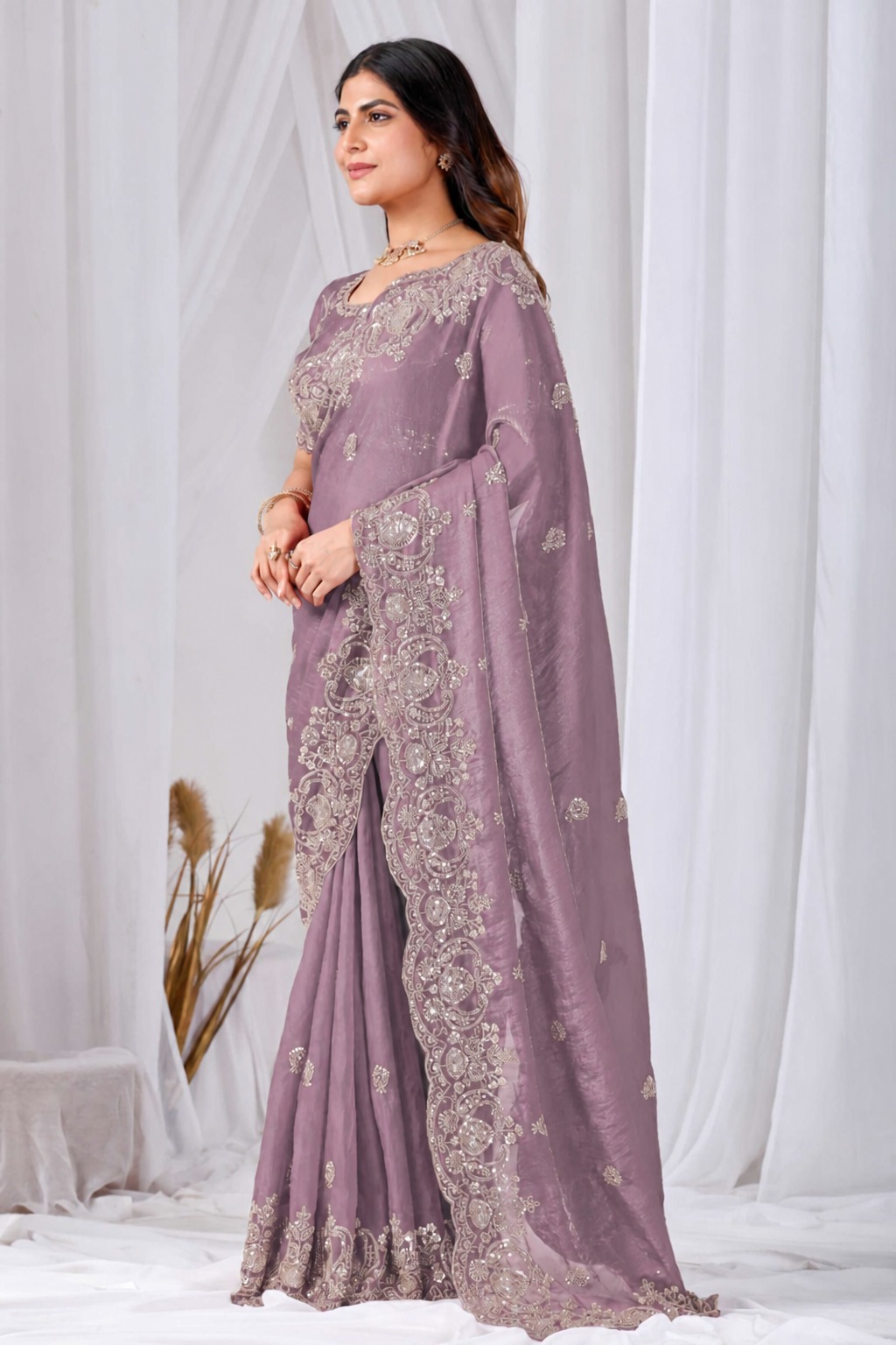 Pink Tikki Moti Work Embroidered Designer Saree Pink Tikki Moti Work Embroidered Designer Saree + The Pink Tikki Moti Work Embroidered Designer Saree brings tikki (metallic sequin) and moti (pearl-bead) hand embroidery to a pink base, and it's built for anyone comparing options for a pink saree rather than something purely decorative. The colour reads true in both daylight and indoor event lighting, which matters more than it sounds &mdash; a lot of sarees photograph differently under venue lighting than they do in a product shot, and this one has been chosen to hold its tone consistently. &bull; Craftsmanship