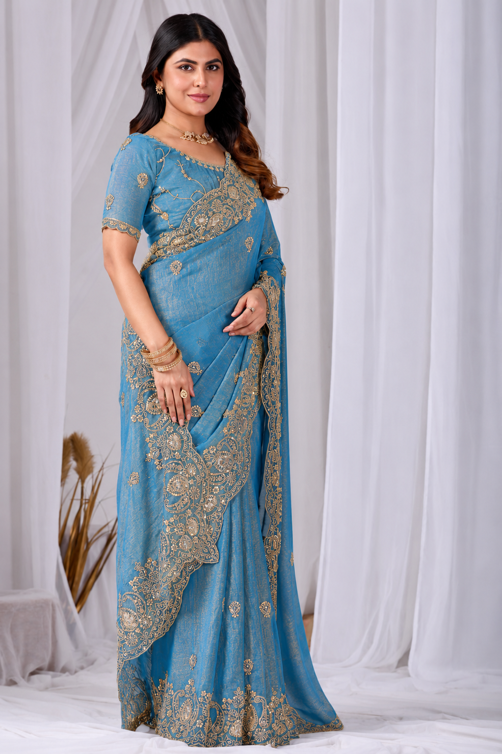 Azure Blue Tikki Moti Work Embroidered Designer Saree Azure Blue Tikki Moti Work Embroidered Designer Saree + The Azure Blue Tikki Moti Work Embroidered Designer Saree brings tikki (metallic sequin) and moti (pearl-bead) hand embroidery to a azure blue base, and it's built for anyone comparing options for an azure blue saree rather than something purely decorative. The colour reads true in both daylight and indoor event lighting, which matters more than it sounds &mdash; a lot of sarees photograph differently under venue lighting than they do in a product shot, and this one has been chosen to hold its tone consistently. &bull; Craftsmanship