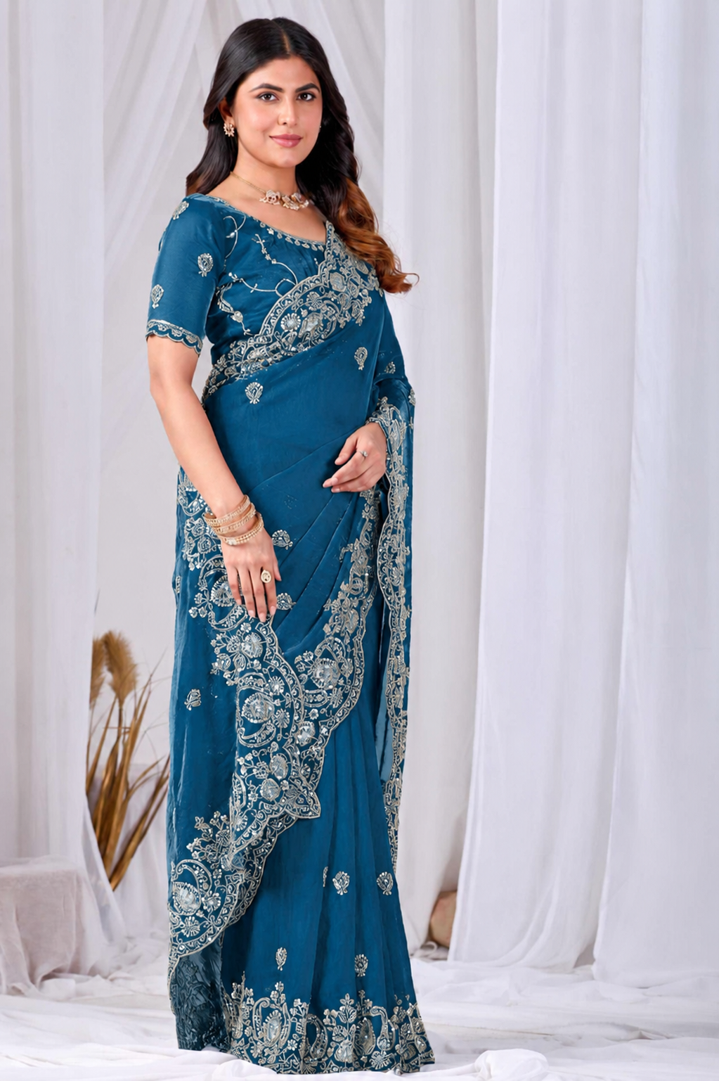Blue Tikki Moti Work Embroidered Designer Saree Blue Tikki Moti Work Embroidered Designer Saree + The Blue Tikki Moti Work Embroidered Designer Saree brings tikki (metallic sequin) and moti (pearl-bead) hand embroidery to a blue base, and it's built for anyone comparing options for a blue saree rather than something purely decorative. The colour reads true in both daylight and indoor event lighting, which matters more than it sounds &mdash; a lot of sarees photograph differently under venue lighting than they do in a product shot, and this one has been chosen to hold its tone consistently. &bull; Craftsmanship