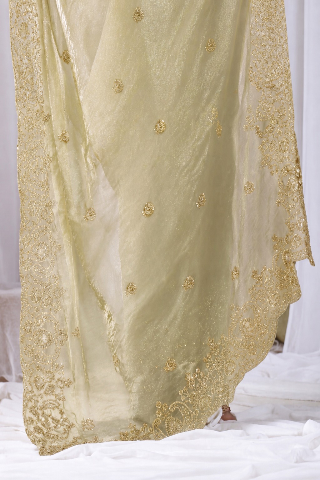 Golden Tikki Moti Work Embroidered Designer Saree Golden Tikki Moti Work Embroidered Designer Saree + The Golden Tikki Moti Work Embroidered Designer Saree brings tikki (metallic sequin) and moti (pearl-bead) hand embroidery to a golden base, and it's built for anyone comparing options for a golden saree rather than something purely decorative. The colour reads true in both daylight and indoor event lighting, which matters more than it sounds &mdash; a lot of sarees photograph differently under venue lighting than they do in a product shot, and this one has been chosen to hold its tone consistently. &bull; Craftsmanship