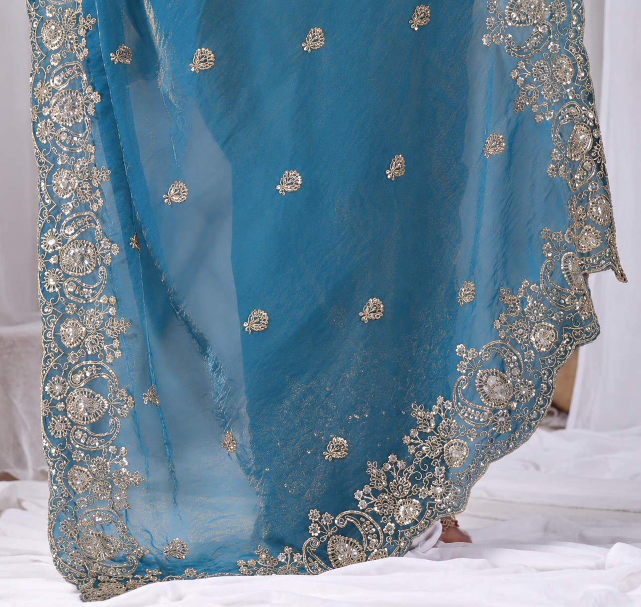 Azure Blue Tikki Moti Work Embroidered Designer Saree Azure Blue Tikki Moti Work Embroidered Designer Saree + The Azure Blue Tikki Moti Work Embroidered Designer Saree brings tikki (metallic sequin) and moti (pearl-bead) hand embroidery to a azure blue base, and it's built for anyone comparing options for an azure blue saree rather than something purely decorative. The colour reads true in both daylight and indoor event lighting, which matters more than it sounds &mdash; a lot of sarees photograph differently under venue lighting than they do in a product shot, and this one has been chosen to hold its tone consistently. &bull; Craftsmanship