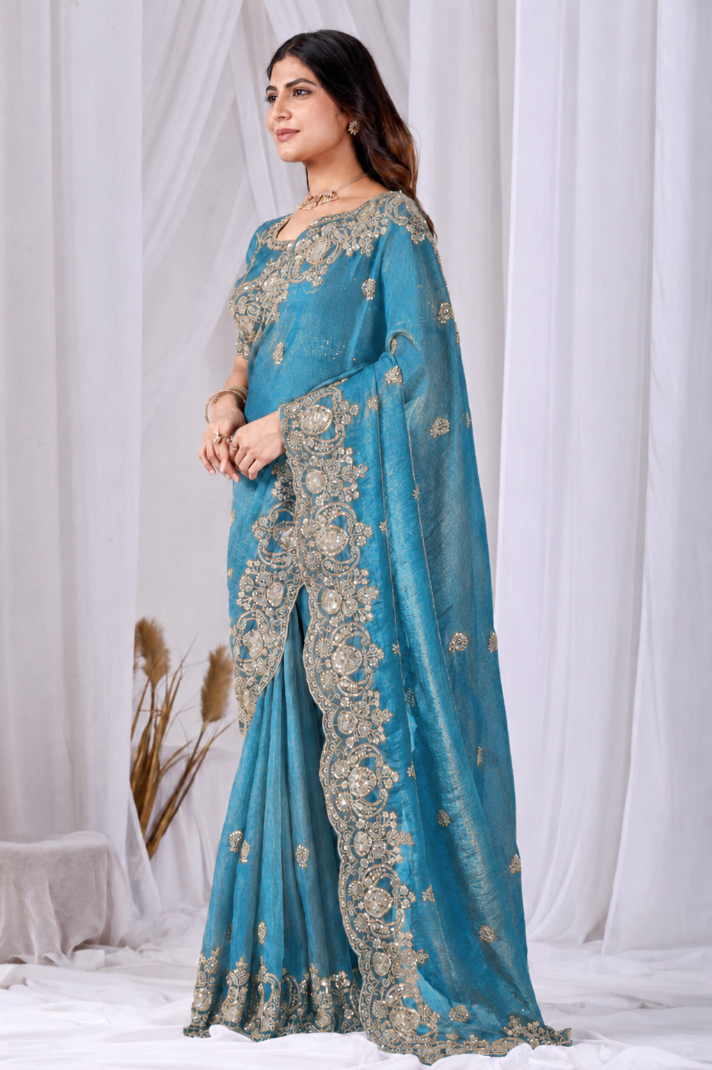 Azure Blue Tikki Moti Work Embroidered Designer Saree Azure Blue Tikki Moti Work Embroidered Designer Saree + The Azure Blue Tikki Moti Work Embroidered Designer Saree brings tikki (metallic sequin) and moti (pearl-bead) hand embroidery to a azure blue base, and it's built for anyone comparing options for an azure blue saree rather than something purely decorative. The colour reads true in both daylight and indoor event lighting, which matters more than it sounds &mdash; a lot of sarees photograph differently under venue lighting than they do in a product shot, and this one has been chosen to hold its tone consistently. &bull; Craftsmanship