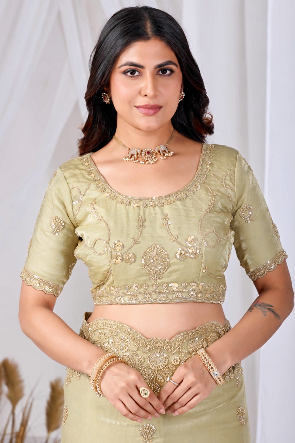 Golden Tikki Moti Work Embroidered Designer Saree Golden Tikki Moti Work Embroidered Designer Saree + The Golden Tikki Moti Work Embroidered Designer Saree brings tikki (metallic sequin) and moti (pearl-bead) hand embroidery to a golden base, and it's built for anyone comparing options for a golden saree rather than something purely decorative. The colour reads true in both daylight and indoor event lighting, which matters more than it sounds &mdash; a lot of sarees photograph differently under venue lighting than they do in a product shot, and this one has been chosen to hold its tone consistently. &bull; Craftsmanship