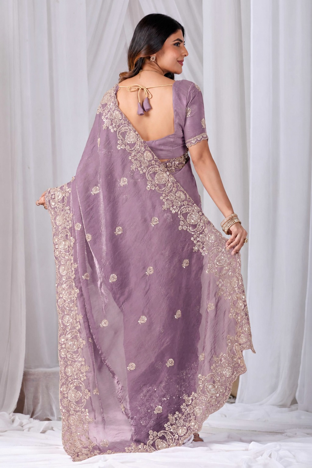 Pink Tikki Moti Work Embroidered Designer Saree Pink Tikki Moti Work Embroidered Designer Saree + The Pink Tikki Moti Work Embroidered Designer Saree brings tikki (metallic sequin) and moti (pearl-bead) hand embroidery to a pink base, and it's built for anyone comparing options for a pink saree rather than something purely decorative. The colour reads true in both daylight and indoor event lighting, which matters more than it sounds &mdash; a lot of sarees photograph differently under venue lighting than they do in a product shot, and this one has been chosen to hold its tone consistently. &bull; Craftsmanship