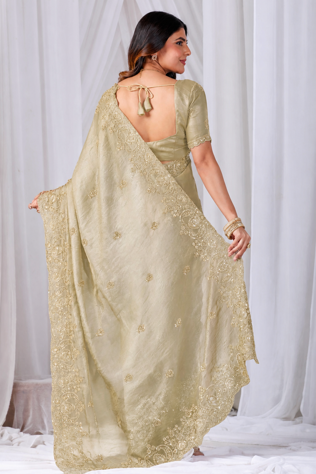 Golden Tikki Moti Work Embroidered Designer Saree Golden Tikki Moti Work Embroidered Designer Saree + The Golden Tikki Moti Work Embroidered Designer Saree brings tikki (metallic sequin) and moti (pearl-bead) hand embroidery to a golden base, and it's built for anyone comparing options for a golden saree rather than something purely decorative. The colour reads true in both daylight and indoor event lighting, which matters more than it sounds &mdash; a lot of sarees photograph differently under venue lighting than they do in a product shot, and this one has been chosen to hold its tone consistently. &bull; Craftsmanship
