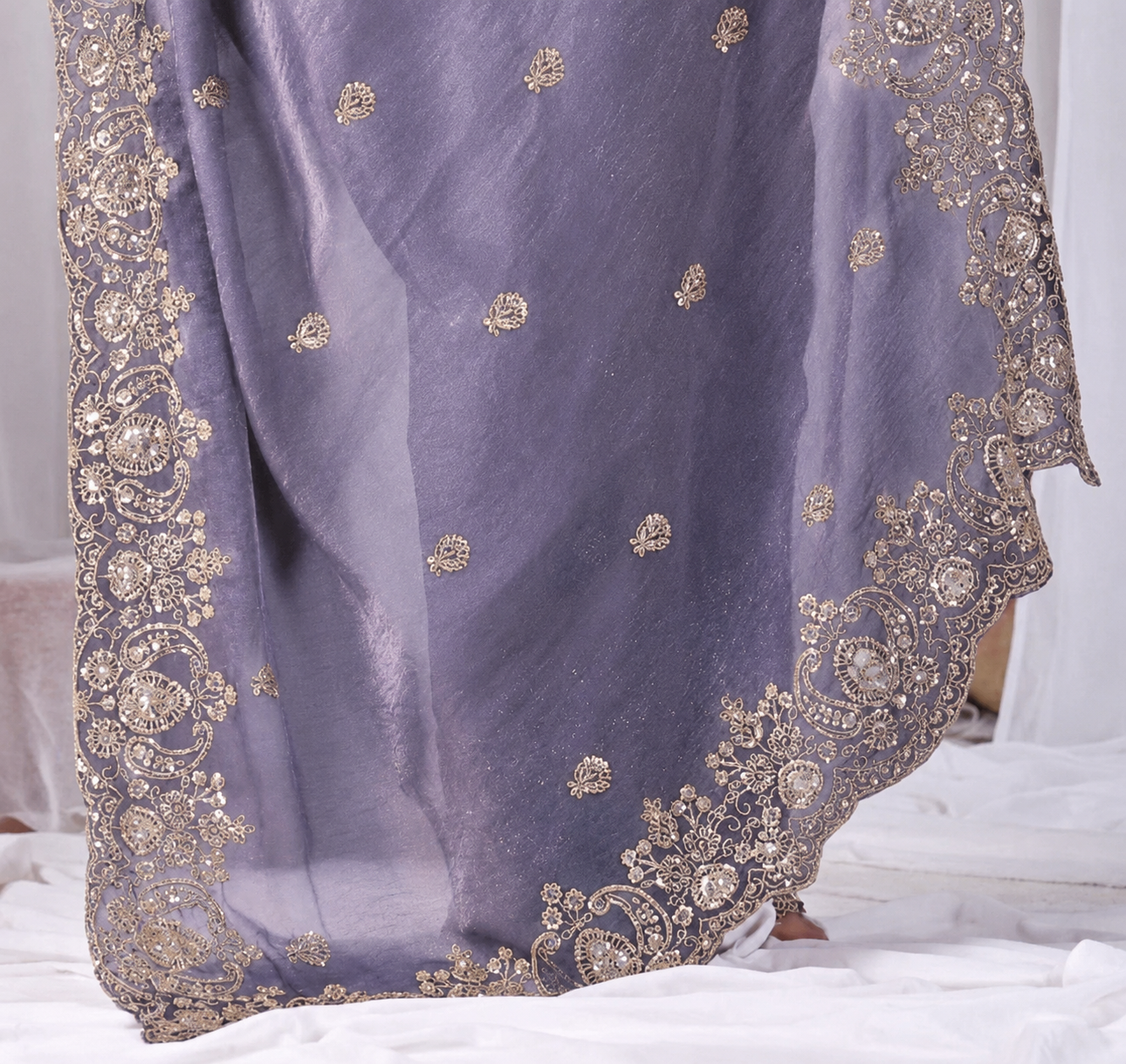Purple Tikki Moti Work Embroidered Designer Saree Purple Tikki Moti Work Embroidered Designer Saree + The Purple Tikki Moti Work Embroidered Designer Saree brings tikki (metallic sequin) and moti (pearl-bead) hand embroidery to a purple base, and it's built for anyone comparing options for a purple saree rather than something purely decorative. The colour reads true in both daylight and indoor event lighting, which matters more than it sounds &mdash; a lot of sarees photograph differently under venue lighting than they do in a product shot, and this one has been chosen to hold its tone consistently. &bull; Craftsmanship
